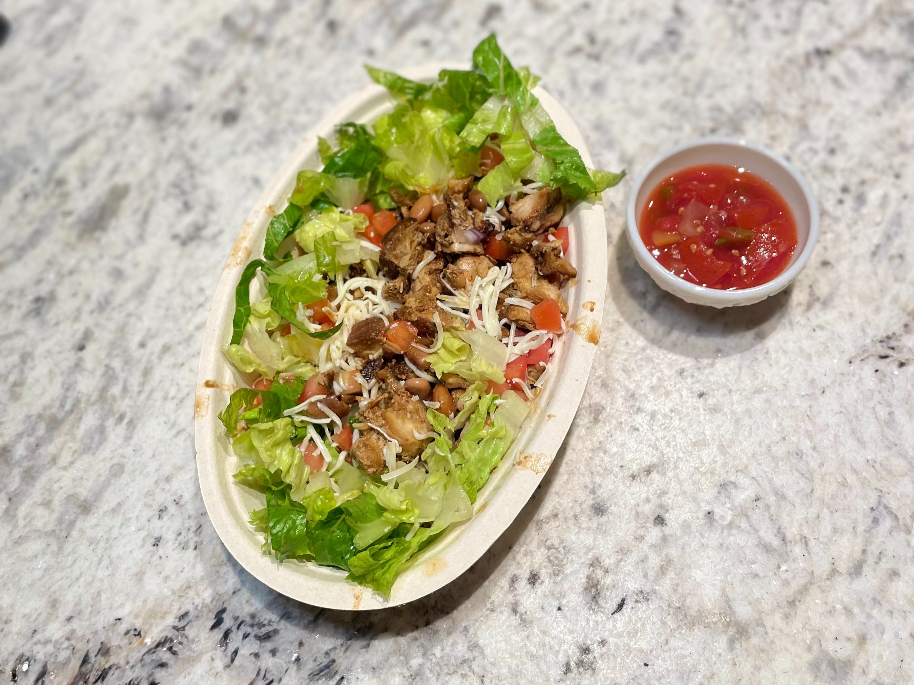 Chicken bowl at Chipotle. Make it lower carb with no rice and extra romaine lettuce.